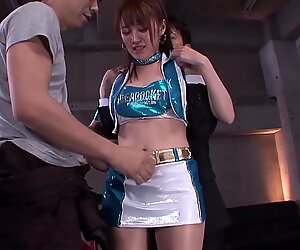 Tsubasa Amami is on her knees pleasuring two pulsating shafts