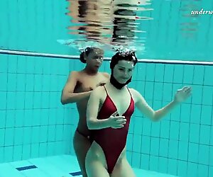 Lesbian fun underwater and naked stripping